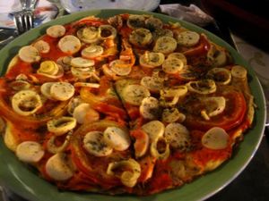 Pizza with tomatoes, hearts of palm, tofu cream and oregano. Not bad. at Vegetariano Social Clube Delivery in Rio De Janeiro