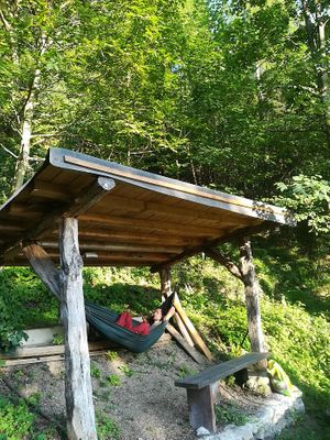 relaxing near our forest at Eco Rooms Slovenia in Sela Nad Podmelcem