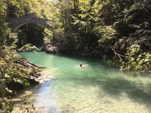 swimming in the river at Eco Rooms Slovenia in Sela Nad Podmelcem