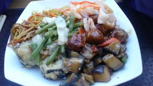 Mixed buffet plate: noodles, cabbage (very nice), green beans, soya balls (ok), aubergine/eggplant, deep fried sushi (I recommend non deep-fried but this is all they had left that day!)  at 96 Zen Etterem in Budapest