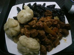 Veggie dumplings, spicy soy and barbecue seitan with potatoes at 96 Zen Etterem in Budapest