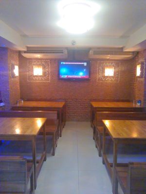 New interior is great complement to great food!
The design and brickwork with the wood benches is warm and calming and makes this a nice sit down restaurant. at Guptaji Ki Kitchen in Bangkok