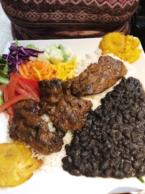 Carne vegetal con menestra. Los patacones súper ricos! at Amaranto in Guayaquil