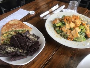 Grilled cheese sandwich and the buffalo cauliflower caesar salad  at Fruits & Roots in Stuart