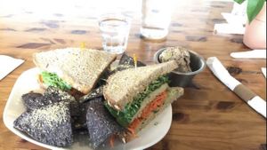 Tempeh sandwich, vegan tuna on the side at Fruits & Roots in Stuart