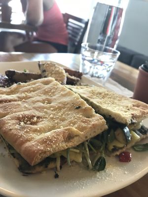 Roasted veggie panini with pesto and potato wedges with rosemary oil and cashew cheese.  at Fruits & Roots in Stuart