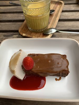 Sticky toffee cake with pecan ice cream, and a turmeric latte  at Bindicafe in Amersfoort