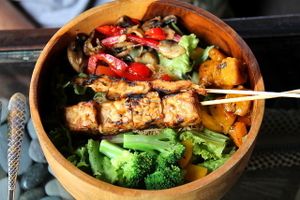 Kismet bowl food with satays.  at Kismet Bar & Kitchen  in Ubud