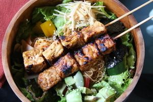Asian bowl with tofu and tempe satays.  at Kismet Bar & Kitchen  in Ubud