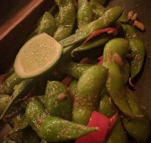 Edamame cooked with coconut oil instead of butter (listed on menu)  at Kismet Bar & Kitchen  in Ubud