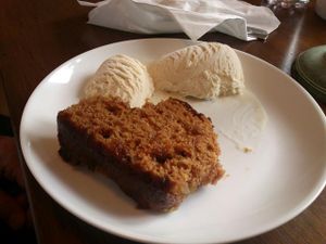Warm ginger and apple cake with vanilla ice cream (vegan) at The HiVe Cafe. at The HiVe Cafe in Weymouth