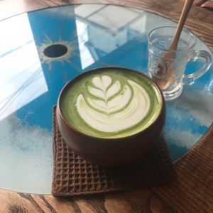 Soy matcha latte by the window at Phalam Cafe in Kyoto