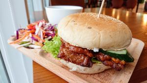 Temptation satay tempeh burger, salad, hot lemon passionfruit tea at nomVnom Bistro - Clarke Quay in Central Singapore