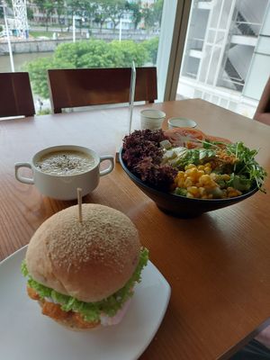 Fish slaw burger, corn soup, salad at nomVnom Bistro - Clarke Quay in Central Singapore