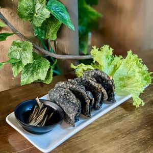 Vegan Charcoal Truffle Gyoza with Black Vinegar Ginger Dip at nomVnom Bistro - Clarke Quay in Central Singapore