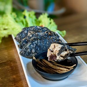 Vegan Charcoal Truffle Gyoza with Black Vinegar Ginger Dip at nomVnom Bistro - Clarke Quay in Central Singapore
