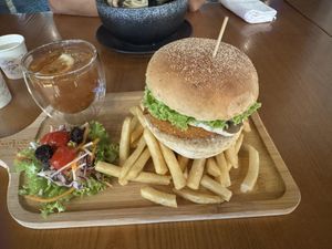 Lion’s Mane Burger with fries, salad and lemon passion fruit tea  at nomVnom Bistro - Clarke Quay in Central Singapore
