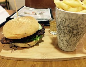 Temptation Satay burger, fries and complimentary apple vinegar drink at nomVnom Bistro - Clarke Quay in Central Singapore