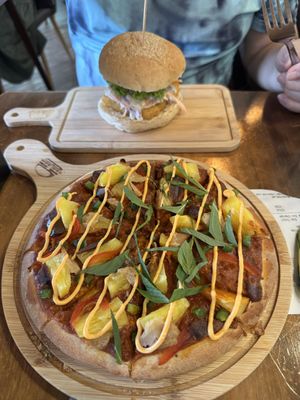 Satay pineapple pizza and Fishless burger that my uncle ordered and ate all of  at nomVnom Bistro - Clarke Quay in Central Singapore