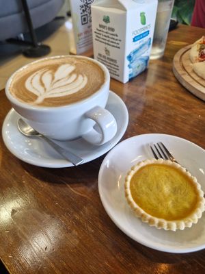 Cafe latte and vegan egg tart at nomVnom Bistro - Clarke Quay in Central Singapore