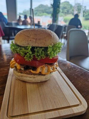 Lion's Xtreme burger: Signature lion's mane mushroom patty, truffle mayo, sauteed button mushrooms, vegan cheese, fresh tomatoes at nomVnom Bistro - Clarke Quay in Central Singapore