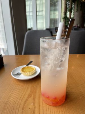 Yuzu strawberry drink - incredible. Egg tart in background.  at nomVnom Bistro - Clarke Quay in Central Singapore