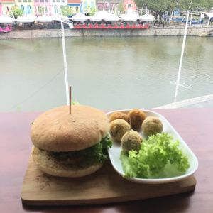 The signature Lion Mane and truffle burger, with potatoe spicy balls. 

The venue has a warm and inviting ambience to complement the delicious burger. 

Enjoy!  at nomVnom Bistro - Clarke Quay in Central Singapore