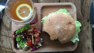 Nom burger (soy patty) with lemon& passion fruit tea at nomVnom Bistro - Clarke Quay in Central Singapore