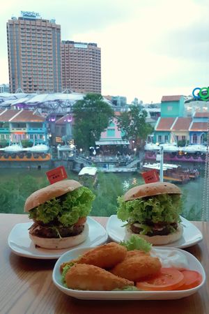 OmniMeat Toona burger ($10.90) and sugarcane drumsticks ($5.90) at nomVnom Bistro - Clarke Quay in Central Singapore