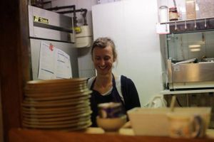 The cook and the tiny kitchen. at Mad'eo in Paris