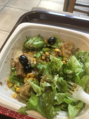 Small salad with olive, artichokes, corn, seeds, and olive oil and vinegar dressing at Veg & Veg in Florence