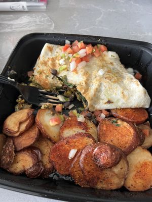 Partially eaten vegan burrito.   at Monty's Blue Plate Diner in Madison