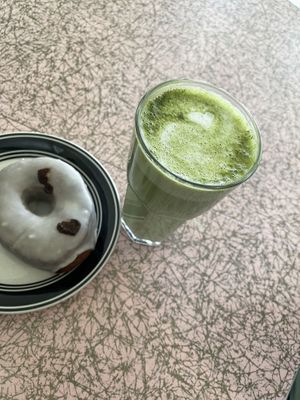 Matcha oat milk latte with a level 5 vanilla donut    at Mother Fool's Coffeehouse in Madison