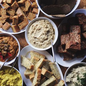 Sunday brunch: homemade raw and baked breads, only one of the with gluten, pesto, vegan scramble, baba ganoush and hummus..! at Barkett in Berlin