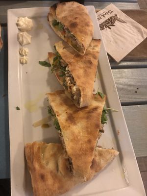Vegan pizza pockets stuffed with zucchini cream,mushrooms,grilled onion,walnut at Pizzeria Capri in Jesolo