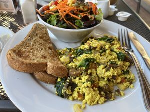 Breakfast scramble with side salad + toast with accidentally vegan margarine   at Busboys and Poets - Carroll St in Washington