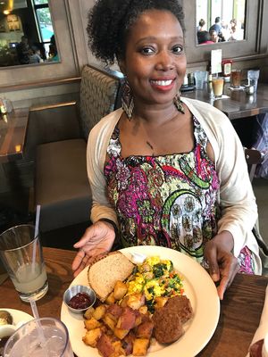 Enjoying a tofu scramble, home fries, and a vegan scramble at Busboys and Poets in Takoma. at Busboys and Poets - Carroll St in Washington
