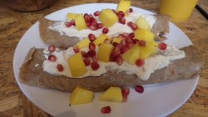 Tofu creme and mango pancakes with pomegranates at Mango Vegan Street Food - Bracka in Warsaw
