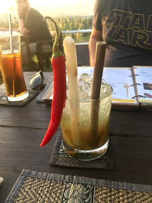 Galangal cocktail. This takes a long time to make because it is made from scratch, so be patient on this one, it's certainly worth it. Bamboo straw, chili & sugar cane (not spicy). at Rice Paddy in Koh Yao Noi