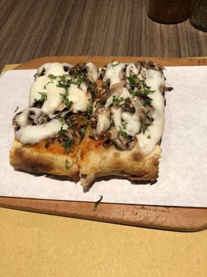 Vegan mozzarella on mushroom pizza at Pizza Pala Romana in Bangkok