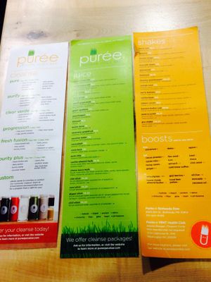 Menu taped to counter at Puree Juice Bar in Washington