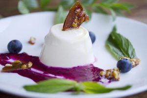 Cardamon Vanilla Pannacotta with White chocolate, Beetroot & Lime Ganache, topped with Pine nut Brittle and Blueberries at The Dandylion Bondi in Bondi