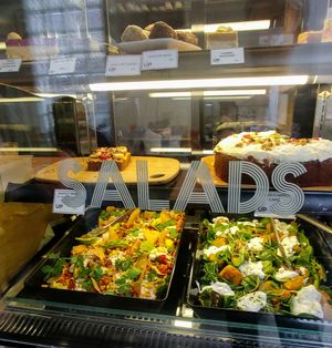 Salad and cake cabinet at Urban Projuice in Albert Park
