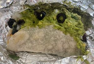 Taco with beans, pesto, olives, guacamole, corn salsa, rice  at Illegal Pete's in Greenwood Village
