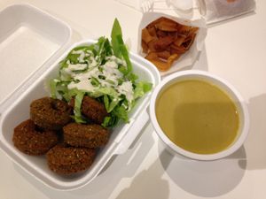 falafel and salad with tahini, lentil soup, pita chips at Super Falafel - Balcescu in Bucharest