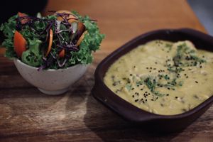 yellow pepper stew with salad  at Siembra in Lima