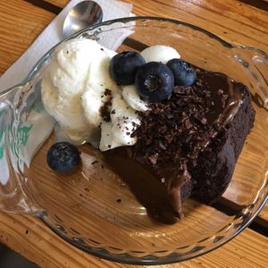 Chocolate cake with ice cream and blue berries at Siembra in Lima