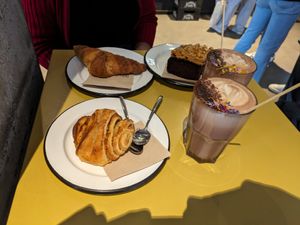 Apple cinnamon bread, croissant leftover from yesterday, peanut butter chocolate cake, and hot chocolates at Lost Weekend in Munich