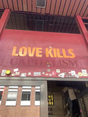 Love K*lls Capitalism Signage  at Lost Weekend in Munich