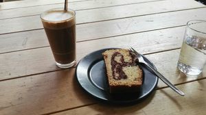 Latte with oat milk and the delicious vegan marble cake... The portions they offer are huge! :) at Lost Weekend in Munich